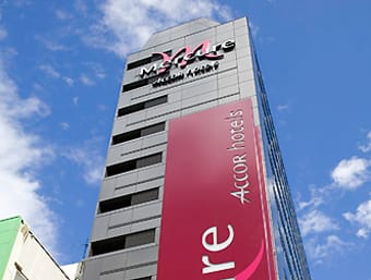 a tall building with a sign on the side of it.