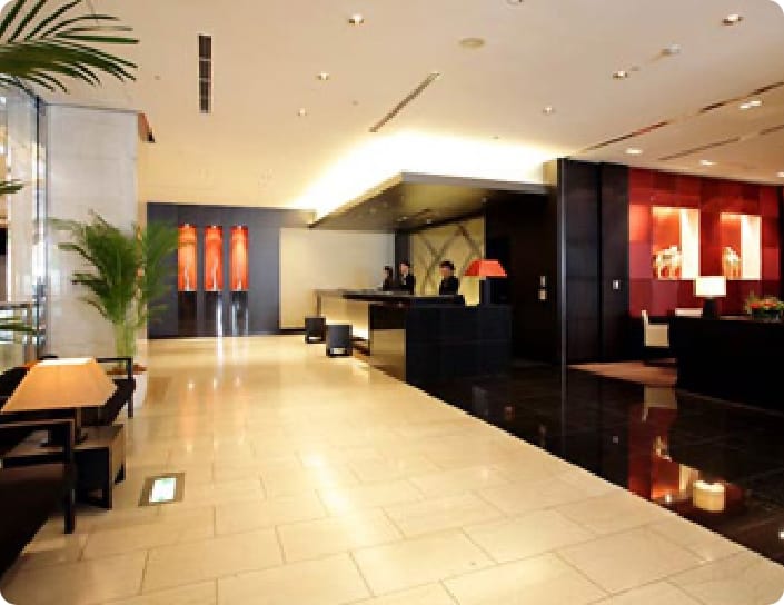 a hotel lobby with a black and red theme.