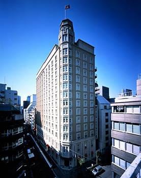 a tall building with a flag on top of it.